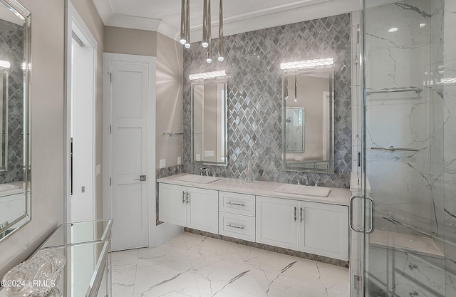 bathroom featuring ornamental molding, an enclosed shower, and vanity