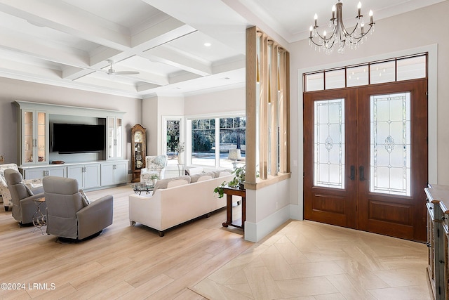 entrance foyer featuring coffered ceiling, a chandelier, light wood-type flooring, ornamental molding, and beamed ceiling