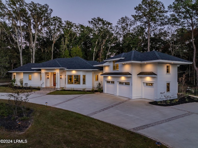 prairie-style home featuring a garage