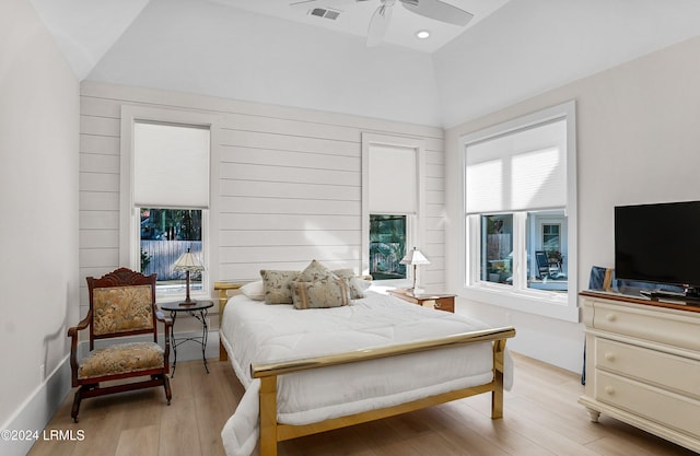 bedroom featuring vaulted ceiling, ceiling fan, and light hardwood / wood-style floors