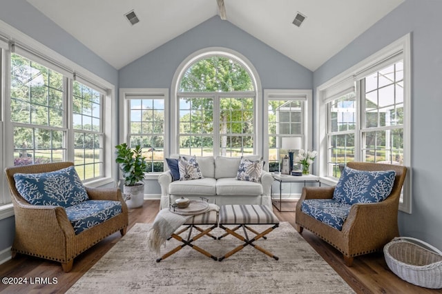 sunroom / solarium with lofted ceiling and visible vents