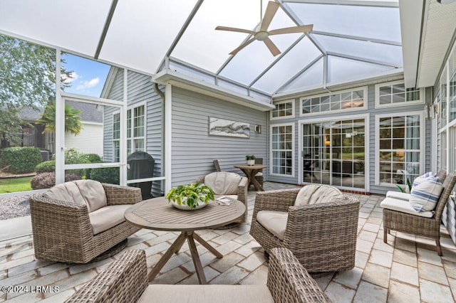 sunroom / solarium featuring ceiling fan and lofted ceiling