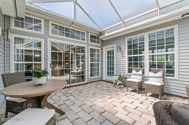 sunroom featuring lofted ceiling