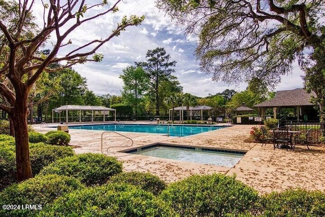 community pool featuring a patio area, a gazebo, a community hot tub, and a pergola