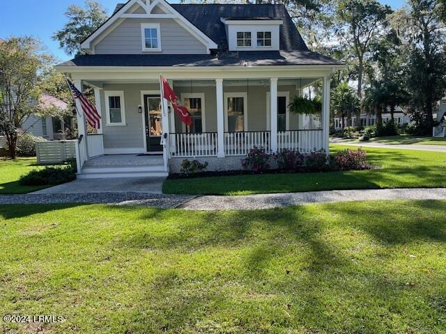 view of front of home with a front lawn and a porch