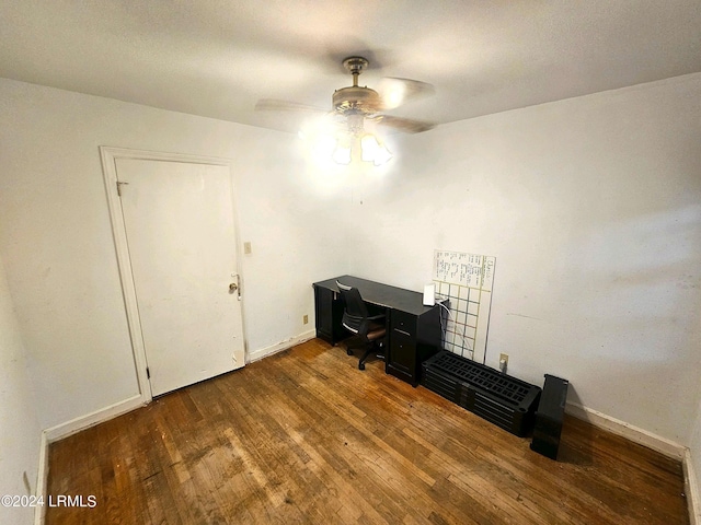 office space featuring dark hardwood / wood-style floors and ceiling fan