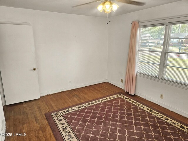 home office with hardwood / wood-style flooring and ceiling fan