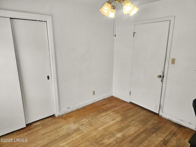 spare room featuring hardwood / wood-style floors and ceiling fan