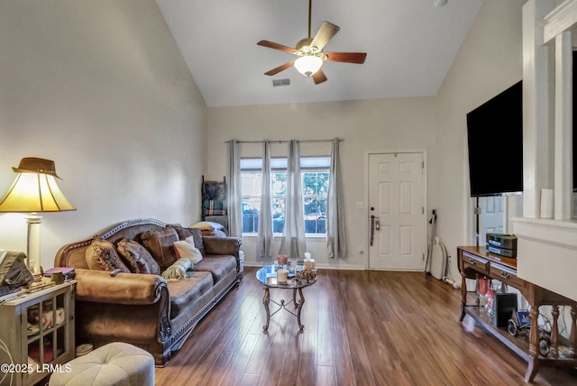 living room with dark hardwood / wood-style flooring, high vaulted ceiling, and ceiling fan