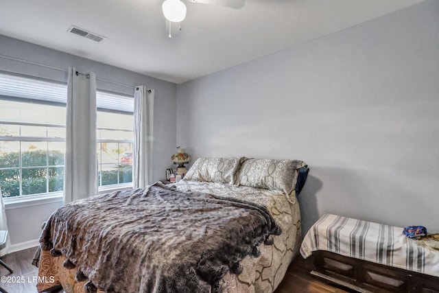 bedroom with hardwood / wood-style floors and ceiling fan