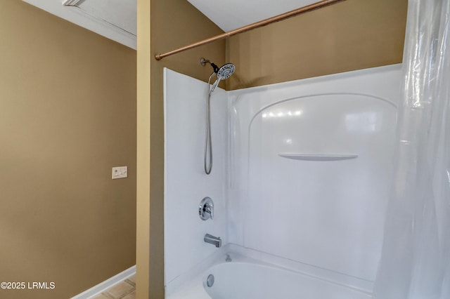 bathroom with shower / bath combo