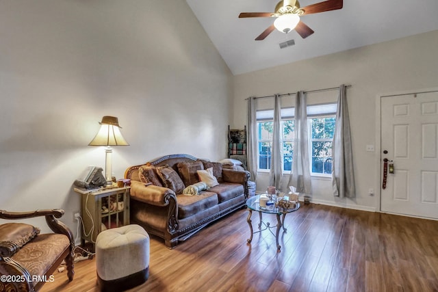 living room featuring ceiling fan, wood-type flooring, and high vaulted ceiling