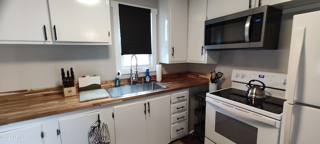 607 Waight St, Beaufort, SC 29902 - kitchen featuring sink, white cabinets, and white appliances