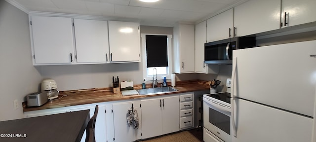607 Waight St, Beaufort, SC 29902 - kitchen featuring sink, white cabinets, and white appliances