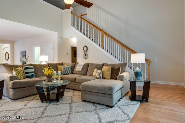 living room with hardwood / wood-style floors and ceiling fan