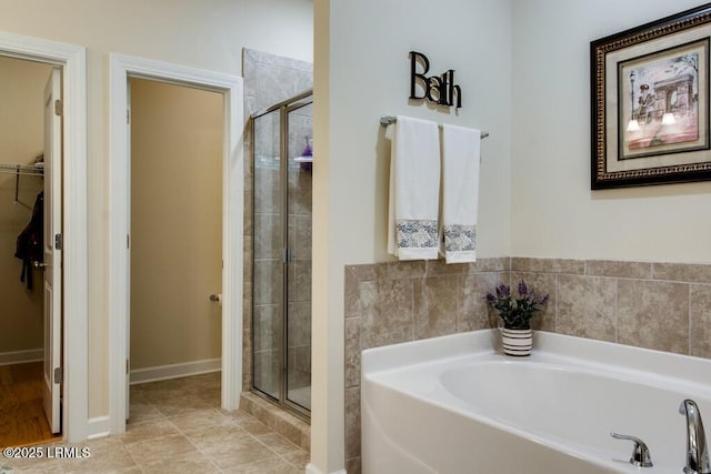 bathroom featuring shower with separate bathtub and tile patterned floors