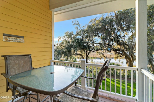 balcony featuring outdoor dining area