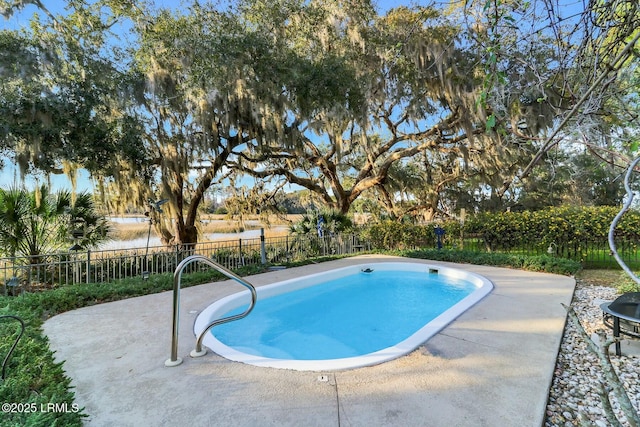 view of swimming pool with a fenced in pool, a patio, and a fenced backyard