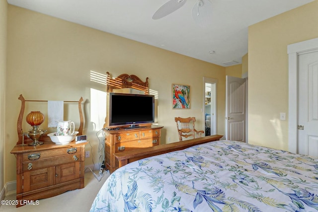 carpeted bedroom with a ceiling fan