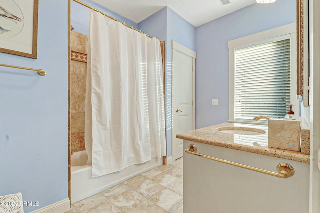 full bathroom with visible vents, shower / bath combo, vanity, and tile patterned flooring