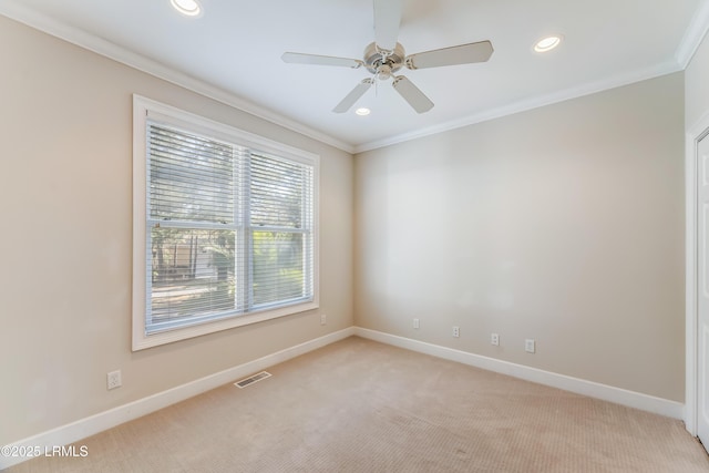 77 Tuscarora Ave, Beaufort, SC 29907 - unfurnished room featuring light carpet, visible vents, and ornamental molding