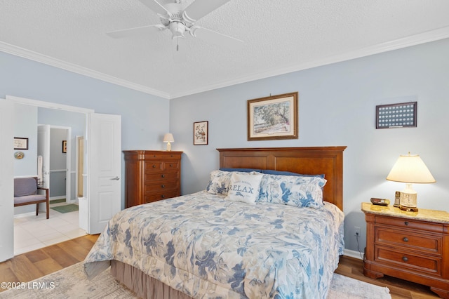 bedroom with ceiling fan, light wood-type flooring, a textured ceiling, and ornamental molding