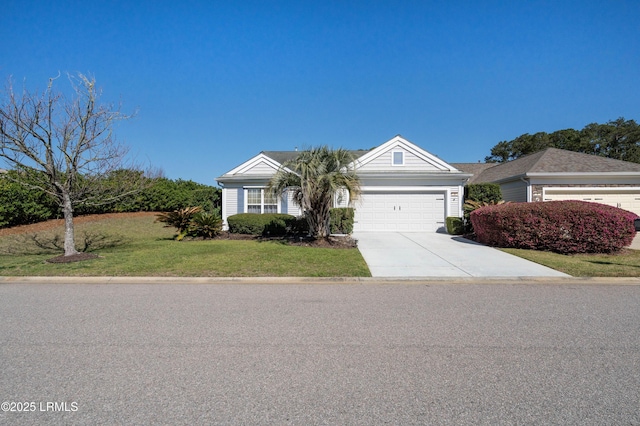 view of front of home featuring an attached garage, concrete driveway, and a front yard