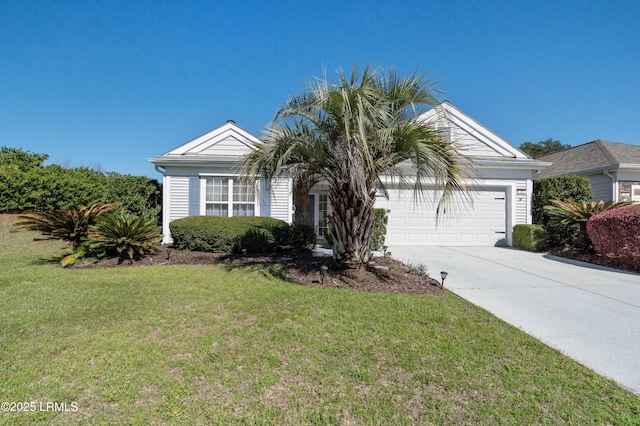 view of front of home featuring an attached garage, driveway, and a front lawn