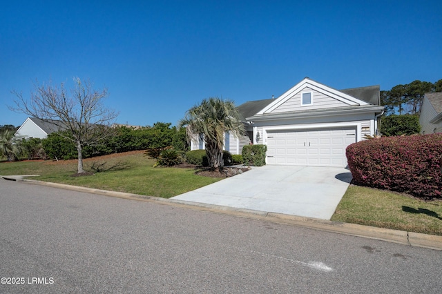 view of front facade with an attached garage, concrete driveway, and a front yard