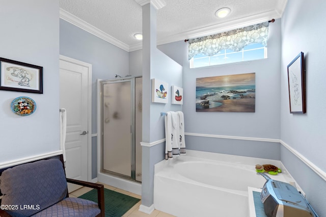 bathroom with a shower stall, crown molding, a textured ceiling, a garden tub, and tile patterned floors