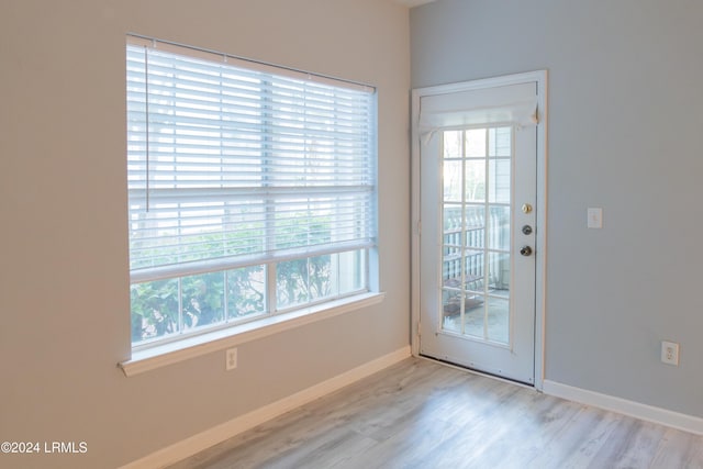 doorway to outside with light hardwood / wood-style floors