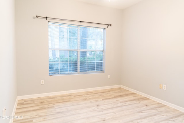 spare room featuring light wood-type flooring