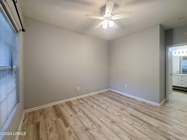 empty room featuring light hardwood / wood-style floors and ceiling fan