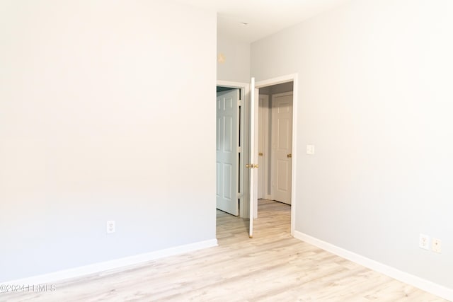 spare room with light wood-type flooring