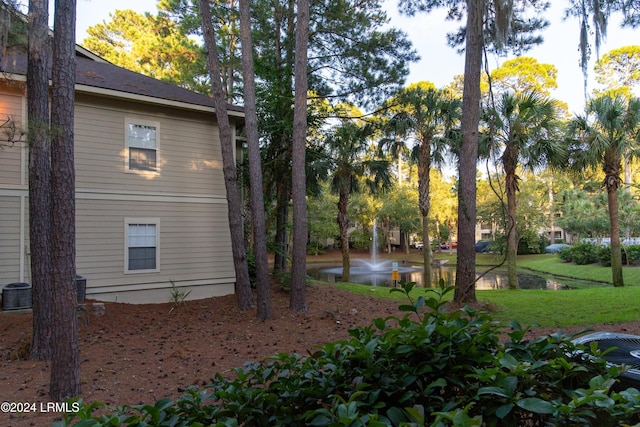 view of property exterior featuring a lawn