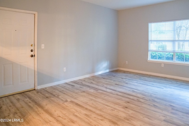 unfurnished room featuring light hardwood / wood-style floors