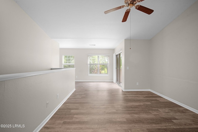 897 Fording Island Rd Unit 209, Bluffton, SC 29910 - empty room with wood finished floors, baseboards, and a ceiling fan