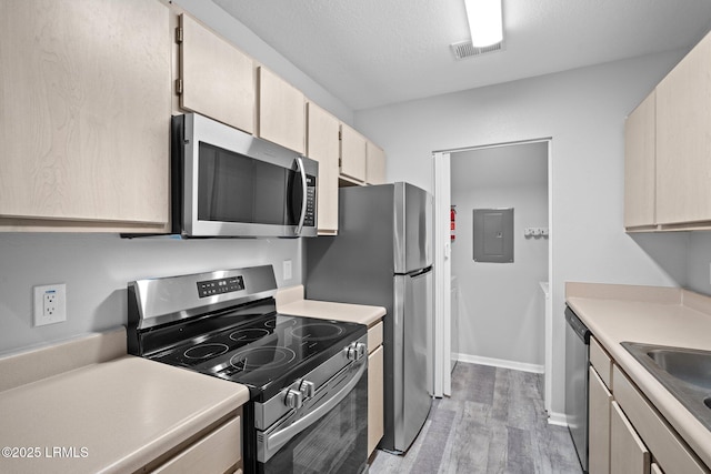 897 Fording Island Rd Unit 209, Bluffton, SC 29910 - kitchen featuring appliances with stainless steel finishes, light wood-type flooring, light countertops, and a sink