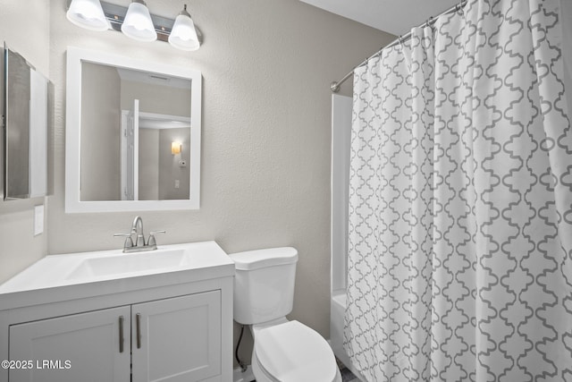 897 Fording Island Rd Unit 209, Bluffton, SC 29910 - bathroom featuring vanity, toilet, shower / tub combo, and a textured wall