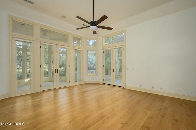 interior space featuring ceiling fan and french doors