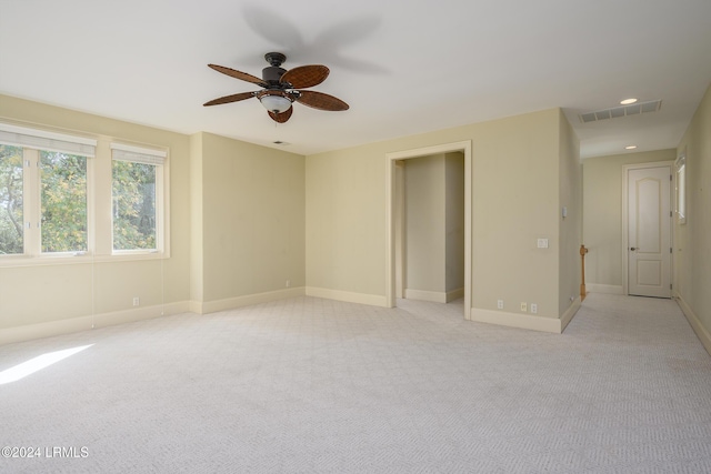 carpeted empty room with ceiling fan