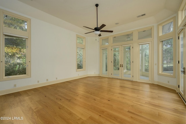 interior space featuring french doors, ceiling fan, and light wood-type flooring