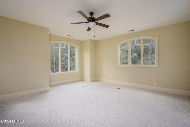 unfurnished room featuring carpet floors and ceiling fan