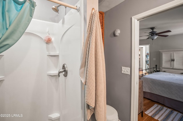 701 Battery Creek Rd, Beaufort, SC 29902 - bathroom featuring toilet, walk in shower, wood finished floors, and a ceiling fan