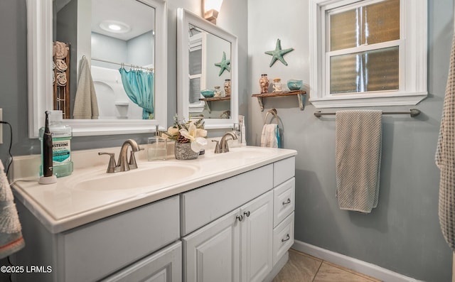 701 Battery Creek Rd, Beaufort, SC 29902 - full bath featuring tile patterned flooring, double vanity, baseboards, and a sink