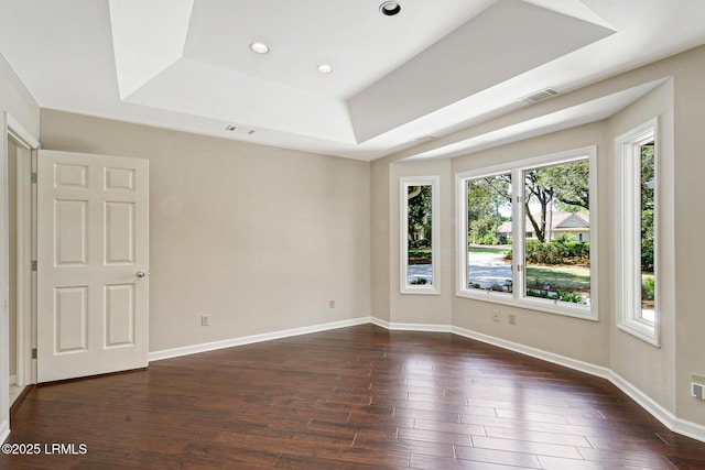 13 Annabella Ln, Hilton Head Island, SC 29926 - spare room with a tray ceiling, dark wood-type flooring, baseboards, and recessed lighting
