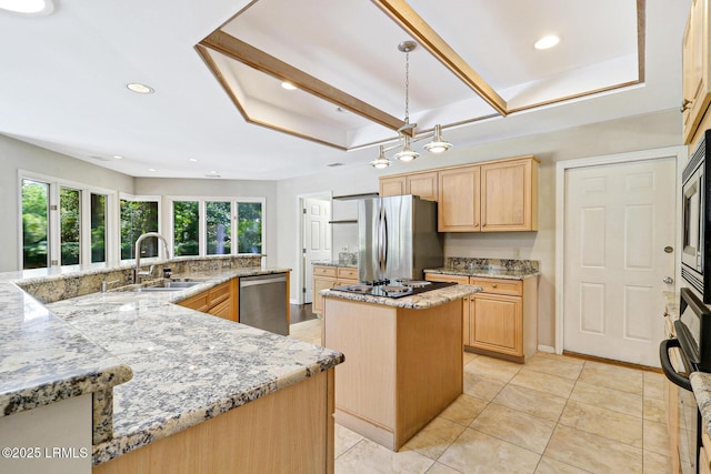 13 Annabella Ln, Hilton Head Island, SC 29926 - kitchen with a sink, a large island, light brown cabinets, stainless steel appliances, and light stone countertops