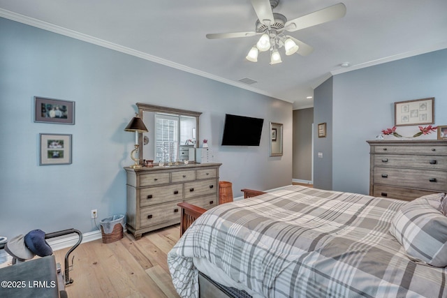 bedroom featuring crown molding, ceiling fan, and light wood-type flooring