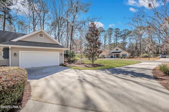 view of property exterior featuring a garage and a yard