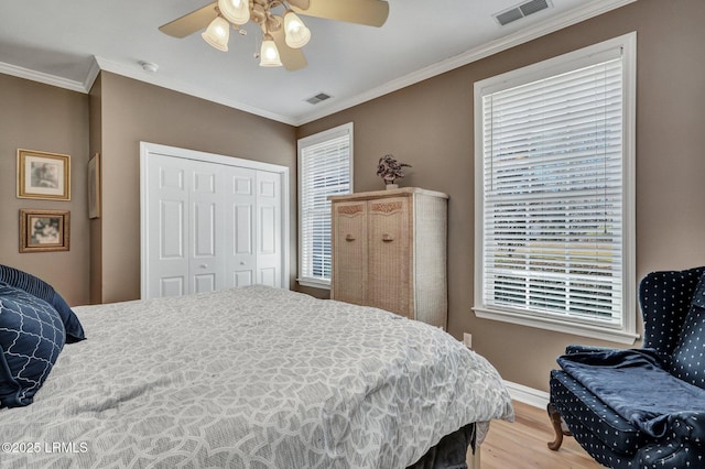 3 Longwood Ct, Okatie, SC 29909 - bedroom with wood finished floors, crown molding, a closet, and visible vents